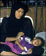 Iraqi mother and sick child - BBC