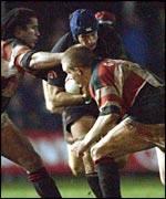 Hywel Jenkins is stopped by Ponty pair Richard Parks and Gethin Jenkins