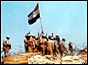 Egyptian soldiers raise a flag on Bar-Lev line bunker in Sinai