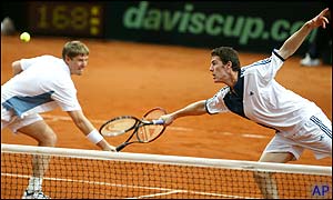 Yevgeny Kafelnikov and Marat Safin reach for the same ball 