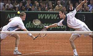 Kafelnikov and Safin stretch for a volley