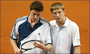 Marat Safin and Yevgeny Kafelnikov stick together during the Davis Cup final