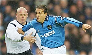 City's Eyal Berkovic holds off the attentions of Bolton's Stig Tofting