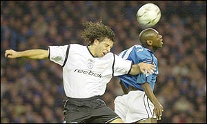 Bolton's Ivan Campo challenges Manchester City's Shaun Goater 