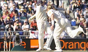 Brett Lee bowls Steve Harmison to claim England's eight and final wicket