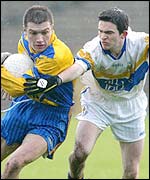 Ryan McCloskey of Enniskillen Gaels comes under pressure from Errigal's Mark Harte