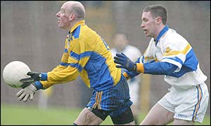 Ollie McShea of Enniskillen comes under pressure from Emmett McGinley