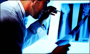 Doctor looks at x-rays