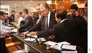 Weapons inspectors check in at their hotel in Iraq.