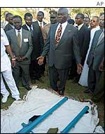 President Moi next to the missile launchers used to fire at the plane