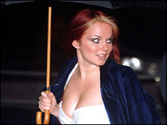 Geri Halliwell shelters from the rain - December 1997