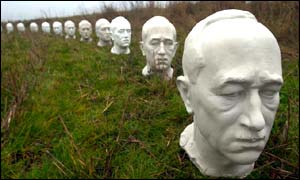 Busts of President Benes lined up along the border