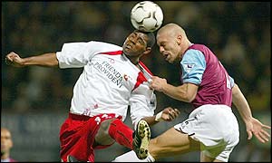 Agustin Delgado of Southampton battles in the air with West Ham's Tomas Repka