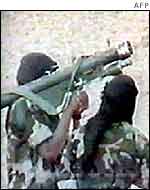 Al-Qaeda militants pose with anti-aircraft missile in archive footage