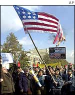 Anti-US protesters burn a US flag in Tehran
