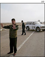 UN inspectors' vehicle blocks the entrance of the al-Muthanna site
