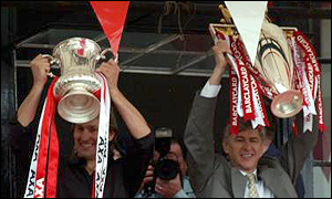 Tony Adams and Arsene Wenger celebrate the Double