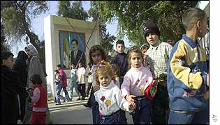 Iraqi families in a Baghdad amusement park