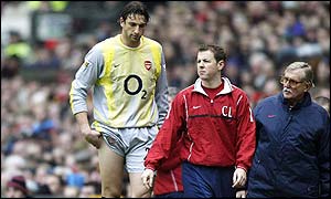 Arsenal's goalkeeper Rami Shaaban is forced off through injury