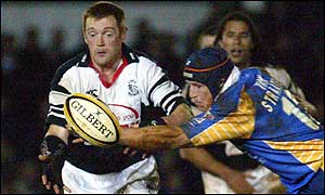 Pontypridd full-back Brett Davey gets a pass away under pressure