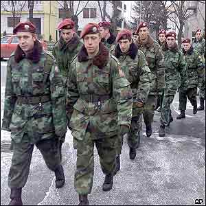 Yugoslav army soldiers march to the polling station in Belgrade