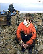 Young volunteer takes a break from cleaning