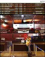 Passenger waits for flight news at Caracas's strike-bound international airport 