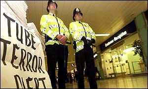 Policemen guard tube entrance