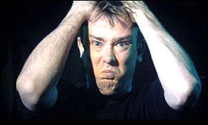 Man holding head in frustration