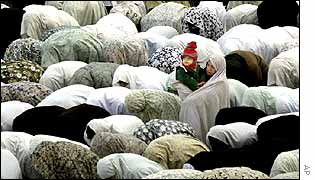 Women in Iran pray during Eid