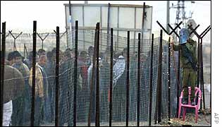 Palestinians at an Israeli border crossing