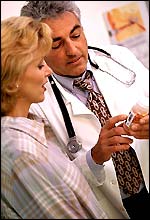 Doctor shows woman pills