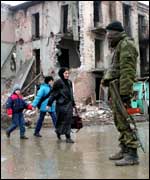Chechen civilians and Russian soldier