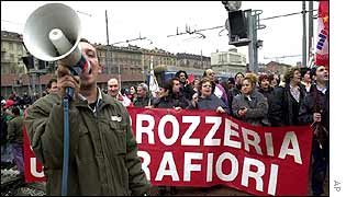 Fiat workers protest at the Porta Nuova train station near the Mirafiori plant in Turin