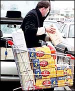 Man loads car with beer