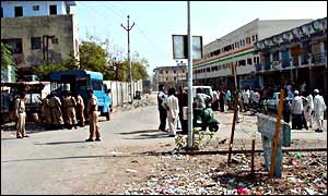 The road dividing the Muslim Juhapura neighbourhood (right) with Hindu Vejalpur (left) - police were called in to calm tension.