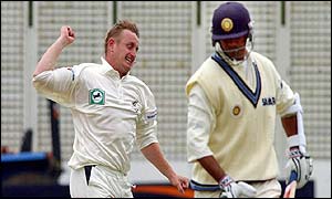 Scott Styris celebrates bowling Rahul Dravid