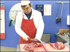 Butcher carving beef