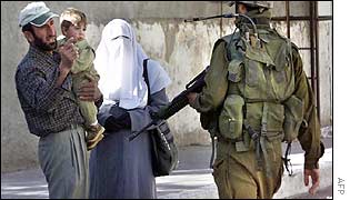 Israeli soldier patrolling Hebron