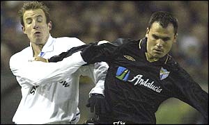 Lee Bowyer of Leeds and Malaga's Gerardo clash