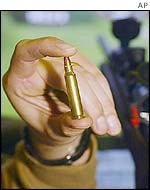 FBI agent holding up bullet