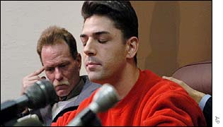 Patrick McSorley is comforted before discussing priestly abuse