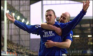 Everton's Wayne Rooney is congratulated for scoring against Blackburn