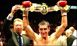 Alex Arthur poses with his belt after beating Carl Greaves 