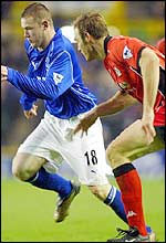 Wayne Rooney skips past Martin Taylor