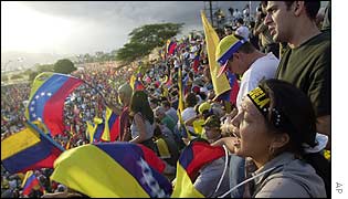 Amaris Fernandez waves her Venezuelan flag during rally against Hugo Chavez at a highway in Caracas