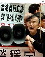 Protester shouts slogans during a demonstration to support a anti-subversion law