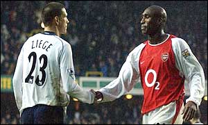 Christian Ziege and Sol Campbell shake hands after the match ends in a 1-1 draw