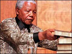 Nelson Mandela with the TRC report