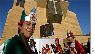 A group of dancers perform in front the Los Angeles Cathedral during celebrations marking Guadalupe Day 12 December